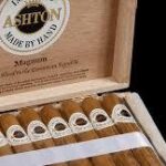Ashton Magnum premium cigars displayed in an open wooden humidor box, imported handmade cigars from Dominican Republic